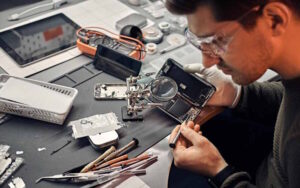Cell Phone Technician repairing a phone