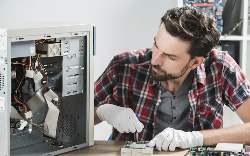 computer technician fixing computer