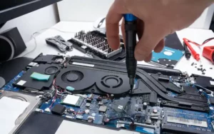 Gurnee compter repair laptop-repair-workshop-male-hand-holds-screwdriver